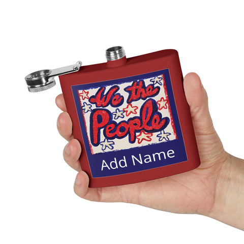 Red flask with 'We the People' design held in a hand against a white background