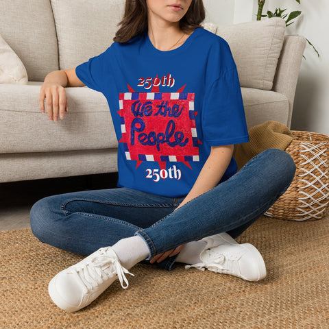 Royal lifestyle shot of Printify 250th Anniversary USA T-Shirt featuring patriotic painting with 'We the People' front and back.